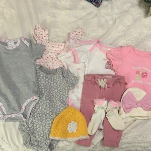 4 different branded onesies